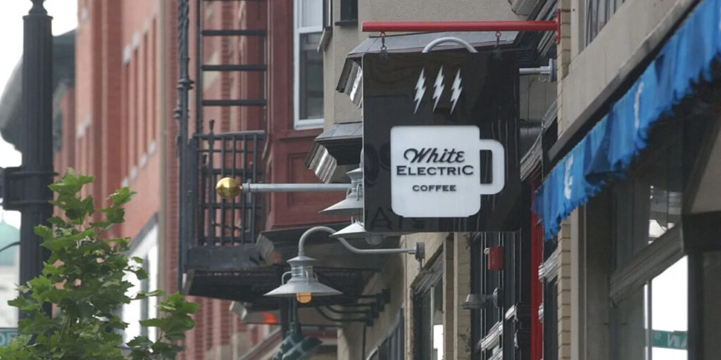 White Electric storefront sign with current logo Providence, RI